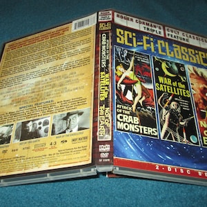 May include: A DVD case with a blue background and the text "Sci-Fi Classics" in white. The case features three movie posters: "Attack of the Crab Monsters", "War of the Satellites", and "Not of This Earth".
