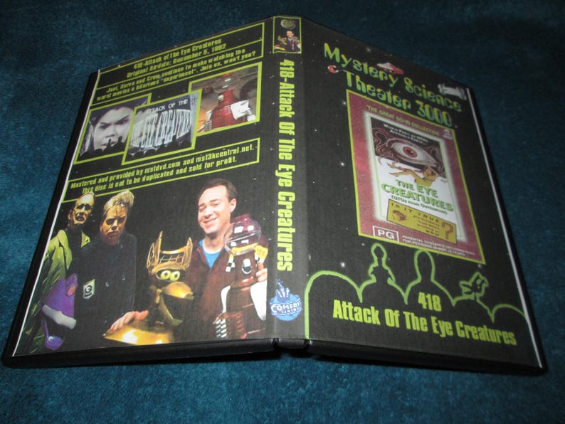 May include: A black DVD case for Mystery Science Theater 3000, episode 418: Attack of the Eye Creatures. The cover features images of the movie and the show's hosts, with the title text in green and white.