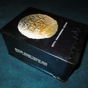 Mystery Science Theater 3000 -20th Anniversary Edition in Large Tin Box includes 4 Episodes, Posters, and Crow T Robot Figure Shout SF 10923
