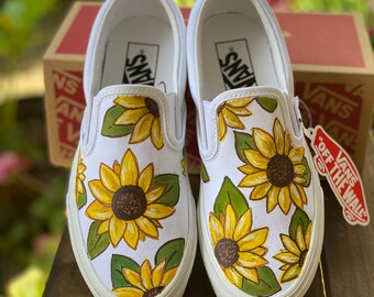 black and white vans with sunflowers