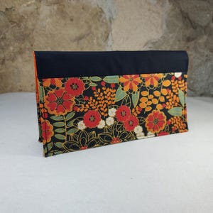 porte chéquier fleurs orange fond noir