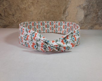 Hairband, wire headband with orange, green, and white flowers