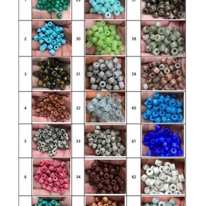 May include: A colour chart showcasing a variety of bead colours, such as green, blue, brown, and white. The chart is labelled "COLOUR CHART" and has codes for each colour. The beads are presented in small piles.