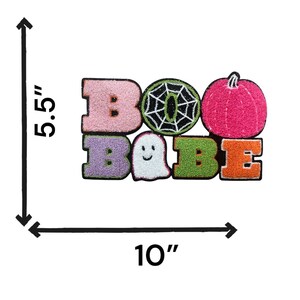 May include: A pink, purple, green, and orange felt patch with the words "BOO BAEE" and a ghost, spiderweb, and pumpkin. The patch is 5.5 inches tall and 10 inches wide.