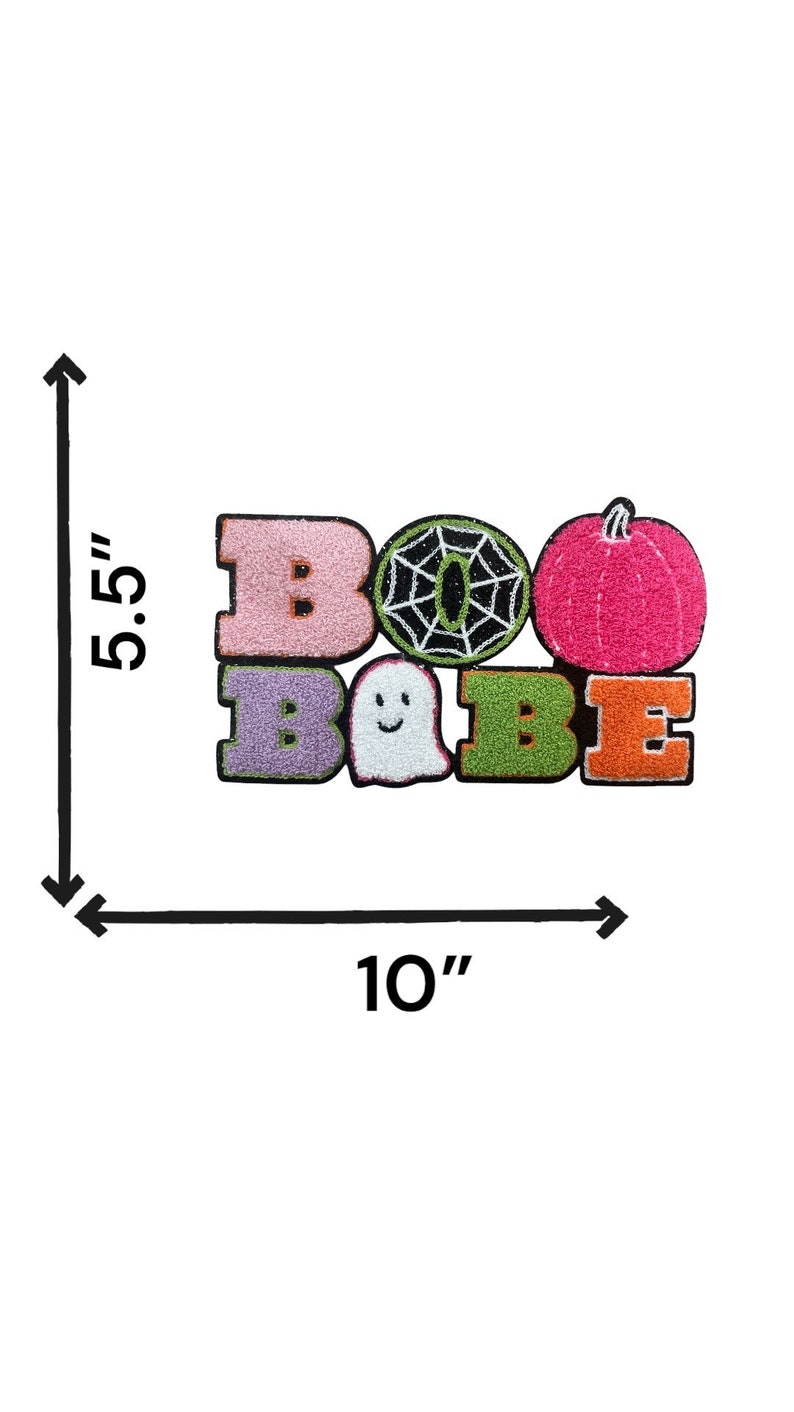May include: A pink, purple, green, and orange felt patch with the words "BOO BAEE" and a ghost, spiderweb, and pumpkin. The patch is 5.5 inches tall and 10 inches wide.