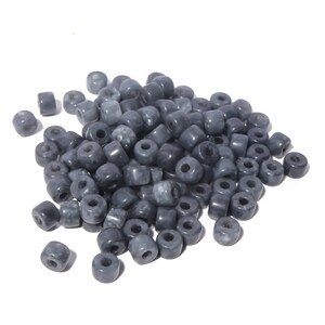 May include: A large pile of gray round beads with a hole in the center. The beads are made of a smooth, opaque material.