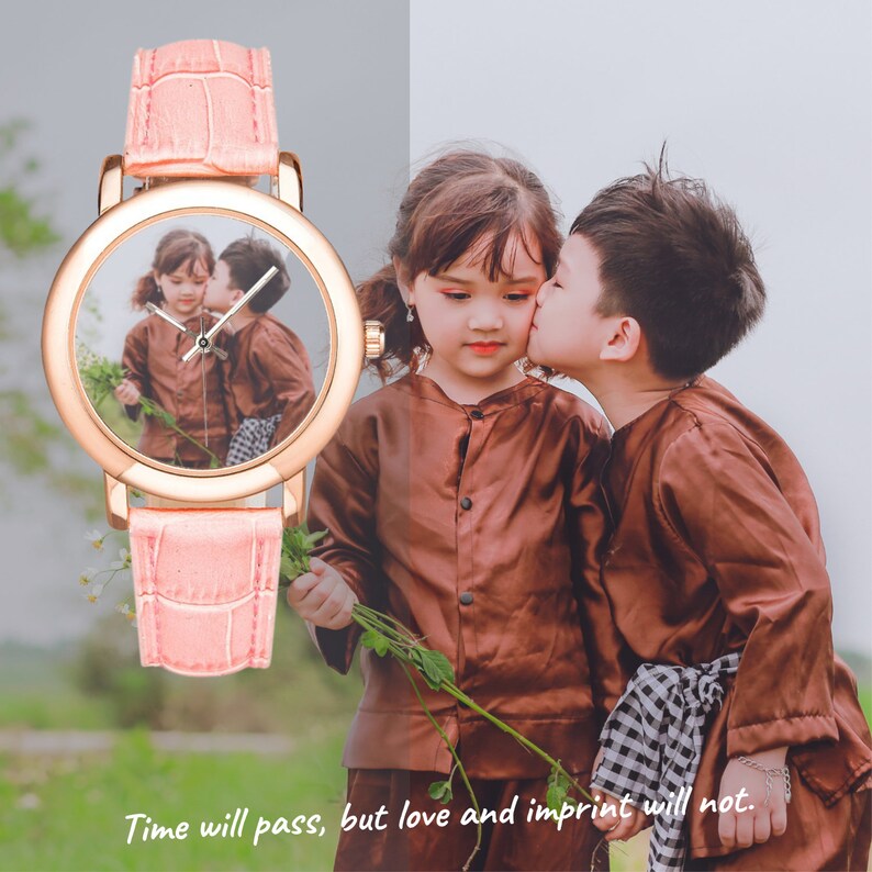 May include: A pink leather wristwatch with a round face featuring a photo of two children. The watch face has a gold rim and white hands. The text "Time will pass, but love and imprint will not." is printed below the watch.