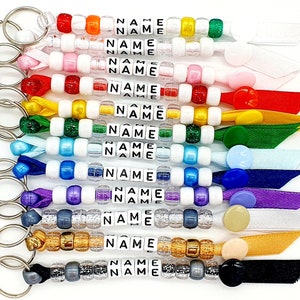 Personalised handmade beaded keyring any name/party bag filler/bag tag/school leaver with your choice of name.