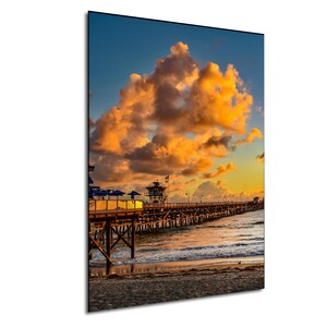 Golden Horizon: Sunset and Billowing Clouds Over San Clemente Pier