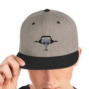 May include: A gray and black baseball cap with a black and white graphic of a skull with headphones on it.