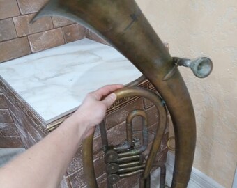 Brass instrument - tenor. Vintage musical instrument trumpet. Retro instrument of the USSR of the 1960s. Present.