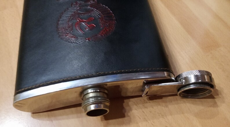 Faux leather wrapper. A flask in a black case with a coat of arms Soviet army flask