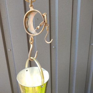 Vintage pocket balance. Collectible metal scales with hook for weighing. Vintage mechanical scales. Rustic 19th century kitchen decor.