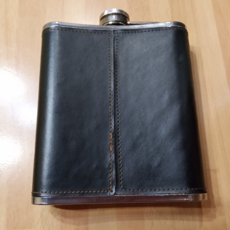 Faux leather wrapper. A flask in a black case with a coat of arms Soviet army flask
