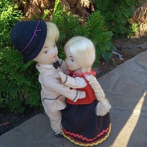 Vintage plastic dolls in national costume.Ethnic motives.Soviet souvenir dancing girl and boy.Old collectible doll of the USSR 1980s.