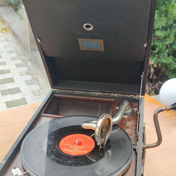 German portable gramophone Electrola in a suitcase. Antique gramophone. Retro phonograph. Recording vinyl records. 1940s.