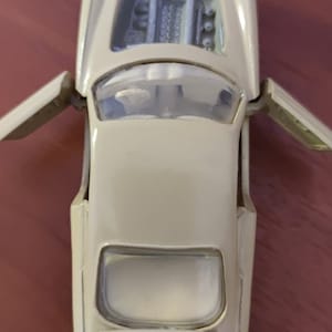 Beige collectible car. Original small car model Ferrari 250 CT Scale 1:43. Unique rare vintage. Toy. Automotive industry of the USSR. 1960s.