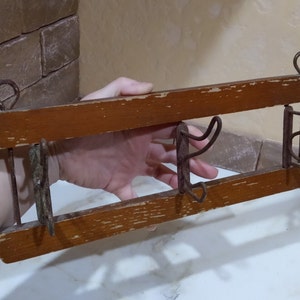 Rare vintage wall hanger with 3 hooks.Rusty entrance hooks.Old wooden hanger with metal hooks.Wall hanger for clothes of the 1960s.Present.
