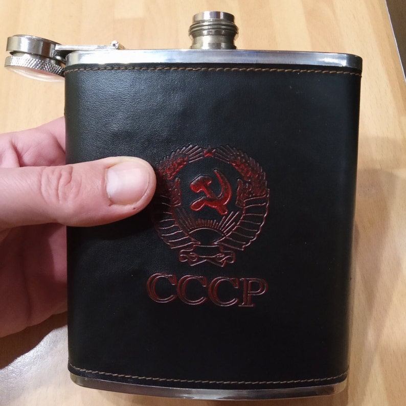 Faux leather wrapper. A flask in a black case with a coat of arms Soviet army flask