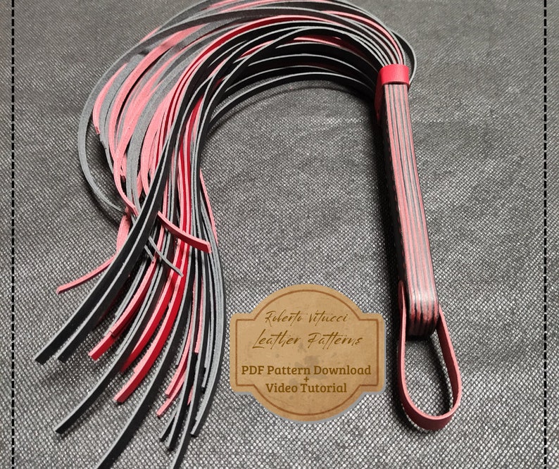 May include: A black and red leather whip with a braided handle. The whip is made of multiple strands of leather that are woven together. The handle is decorated with a red stripe. The whip is a craft project and includes a PDF pattern download and video tutorial.  Roberto Vitucci Leather Patterns.