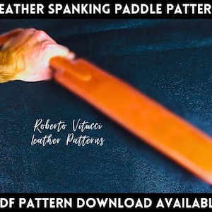 May include: A close-up of a brown leather paddle with a blurred background. The paddle is being held by a hand. The text "Roberto Vitucci leather Patterns" is visible in the image. The text "PDF PATTERN DOWNLOAD AVAILABLE" is at the bottom of the image.