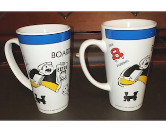 Dos tazas altas de Monopoly ©1999 Hasbro