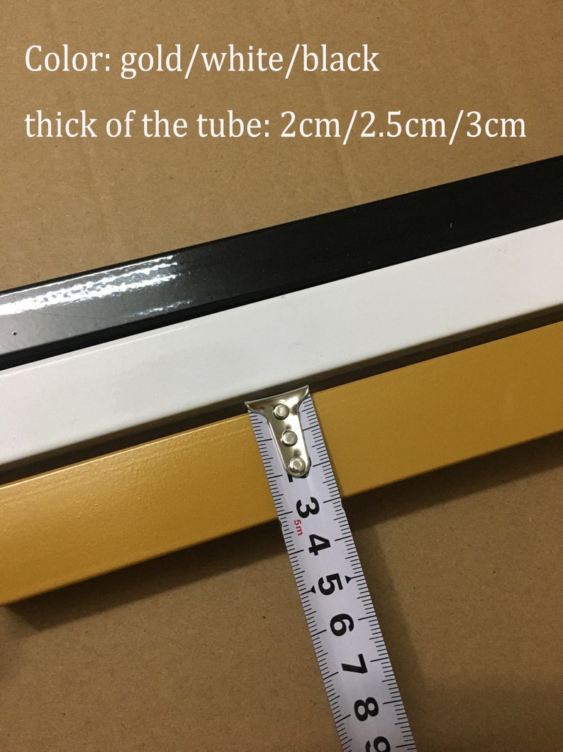 May include: Close-up of a gold, white, and black metal tube. A measuring tape shows the tube is 3 cm thick. The text "Color: gold/white/black" and "thick of the tube: 2cm/2.5cm/3cm" is visible in the image.
