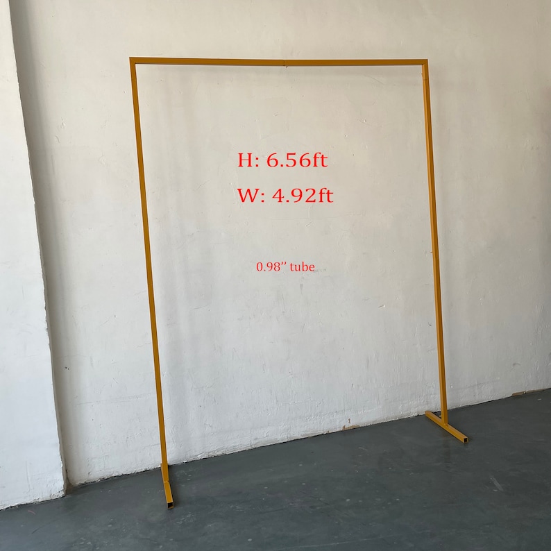 May include: Gold metal archway with a 6.56 ft height and 4.92 ft width. The archway is made of 0.98 inch diameter tubing.