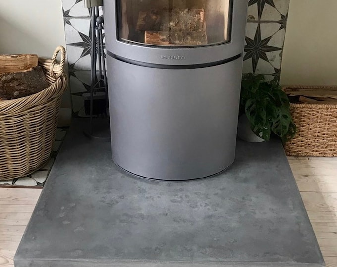 Concrete hearth, modern hearth, minimalist concrete hearth, fireplace surround.