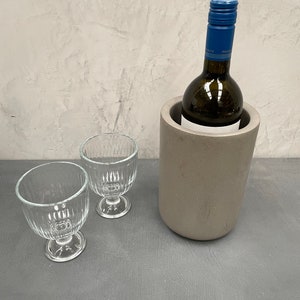 Concrete wine cooler available in black or grey.