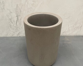 Concrete wine cooler available in black or grey.