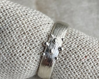 Silver ring band with bark  texture and granulation details ,  Alternative wedding ring