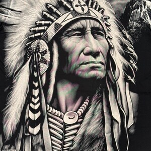 May include: A black and white illustration of a Native American man wearing a headdress with feathers. The man is looking to the right and has a serious expression on his face. The background is a dark gray color.