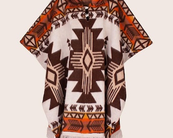 May include: A brown and white poncho with a geometric pattern and orange accents. The poncho has a hood and fringe trim.
