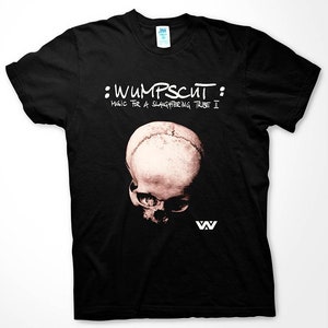May include: Black t-shirt featuring a white skull graphic and the text "Wumpscut: Music for a Slaughtering Tribe II".