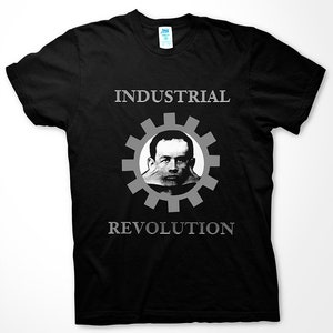May include: Black t-shirt with a white graphic of a man's face inside a gear with the text "INDUSTRIAL REVOLUTION" below.