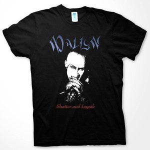 May include: Black t-shirt with a white image of a man with a shaved head and a white shirt. The text "WALLOW" is above the image and "Shatter and Impale" is below the image.
