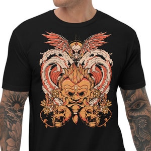 May include: Black t-shirt with a graphic print of a red and orange demon with a third eye, surrounded by skulls and a bird with wings spread.