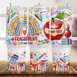 May include: White tumbler with a colourful design featuring a red apple, rainbow, books, pencils, and the text "#TEACHERLIFE".