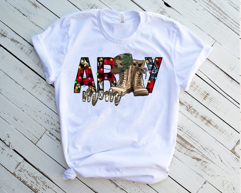 May include: White t-shirt with a red, white, and blue "ARMY" graphic. The letters are decorated with camouflage, Christmas lights, and a pair of military boots.
