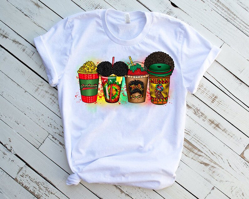 May include: White t-shirt featuring a graphic design of four colourful cups with black hair and faces. The cups are labelled "American", "Soul", "Queen", and "Boss".