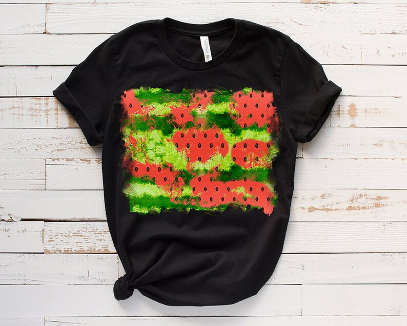 May include: Black t-shirt with a watermelon print. The print features red watermelon slices with black seeds on a green and white background.