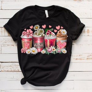 May include: Black t-shirt with a graphic of four coffee cups with flowers and hearts. The cups say "Mama" on one of them.