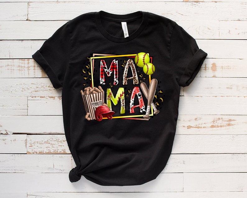 May include: Black t-shirt with a graphic design featuring the words "Mama May" in a colorful, patterned box. The design also includes baseball bats, baseballs, and a popcorn bucket.