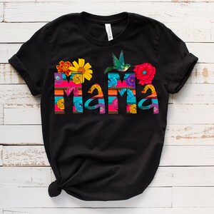May include: Black t-shirt with a colorful "Mama" design featuring flowers, a hummingbird, and stripes.