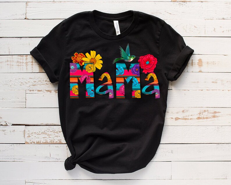 May include: Black t-shirt with a colorful "Mama" design featuring flowers, a hummingbird, and stripes.