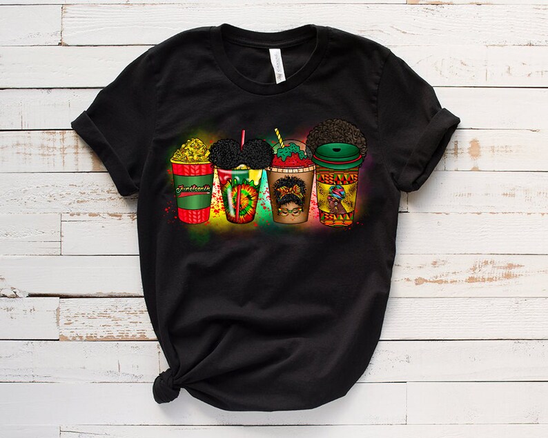 May include: Black t-shirt featuring a graphic of five colourful cups with different designs. The cups are arranged in a row and have a variety of toppings, including whipped cream, sprinkles, and fruit. The graphic is surrounded by a colourful spray paint effect.
