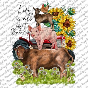 May include: A watercolor illustration of a cow, pig, goat, and chicken on a tractor with sunflowers and daisies. The text "Life is all about Balance" is written in black cursive.