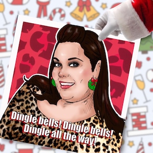 May include: A festive Christmas illustration of a smiling woman with dark hair and green wreath earrings, wearing a leopard print top. The text "Dingle bells! Dingle bells! Dingle all the way!" is displayed in a festive font.