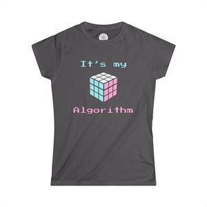 May include: A dark gray t-shirt with the text "It's my Algorithm" in white and a pink and blue Rubik's cube graphic.